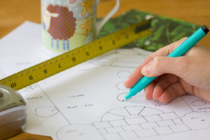 Image of a designer putting together a simple garden plan