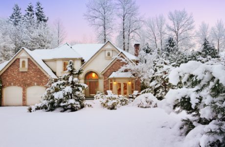 Home with snowy winter landscape