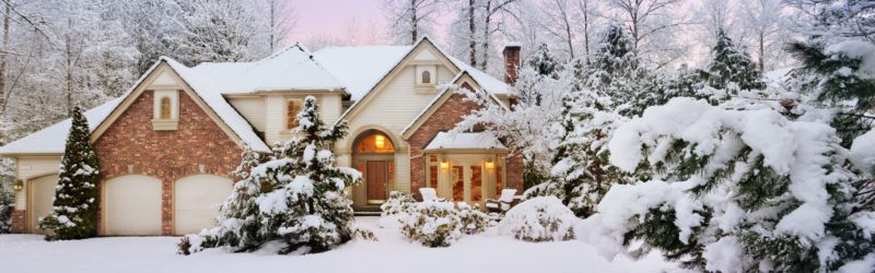 Home with snowy winter landscape