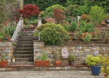 Natural stone steps and garden landscape design on a slope